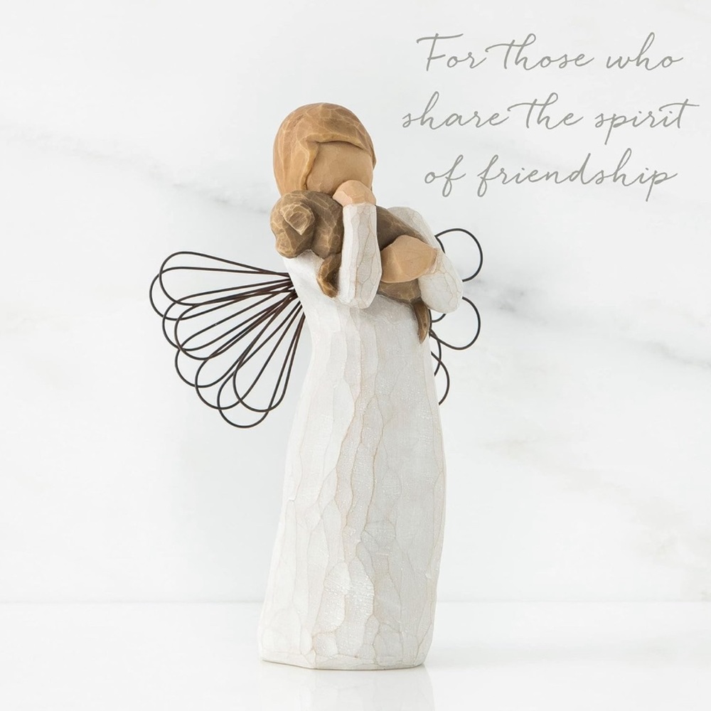 Susan Lordi's Willow Tree "Angel of Friendship" holding a puppy